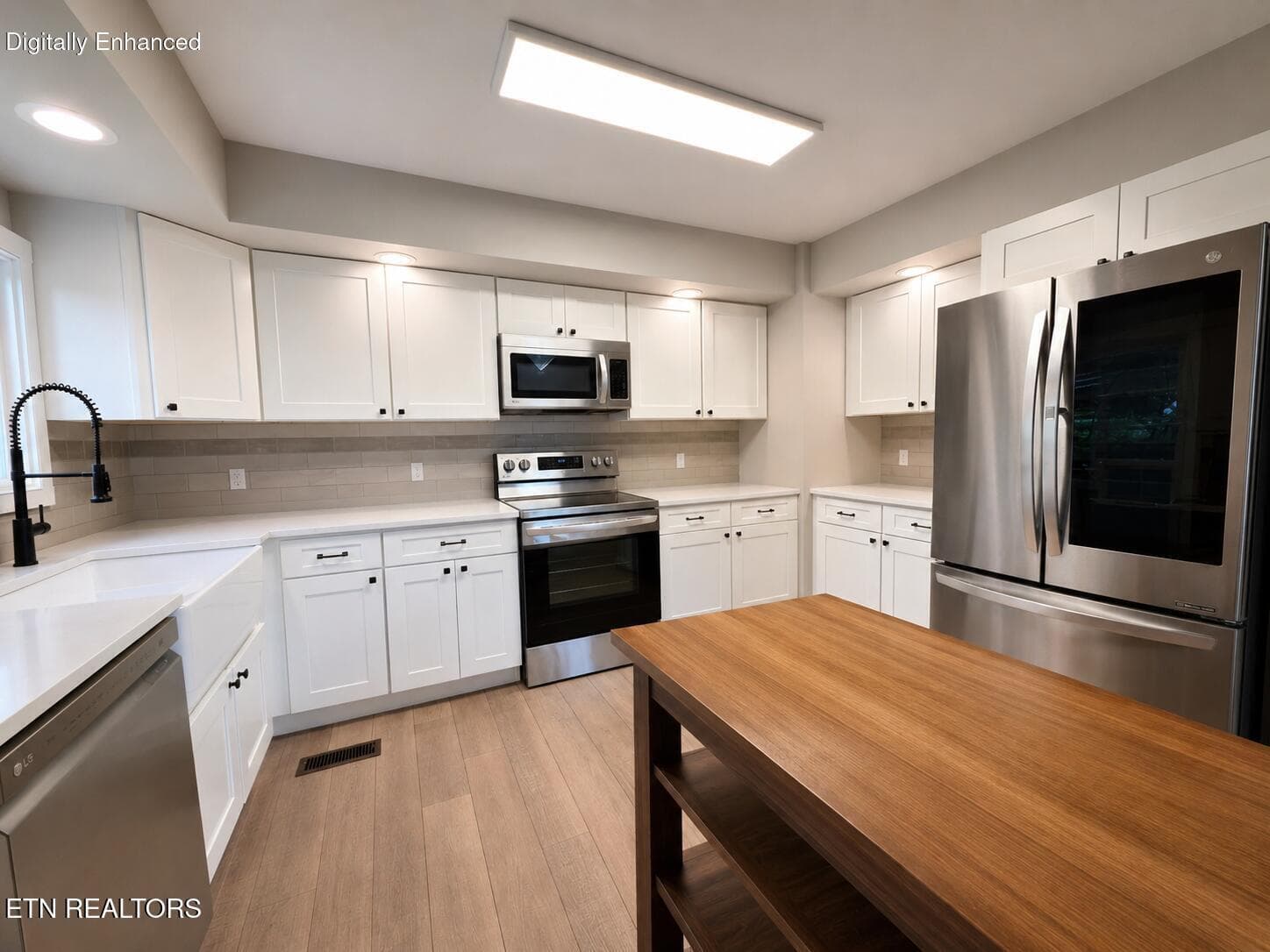 Modern bright kitchen with wood accents - 164 Cheeskogili Way, Loudon, TN 37774