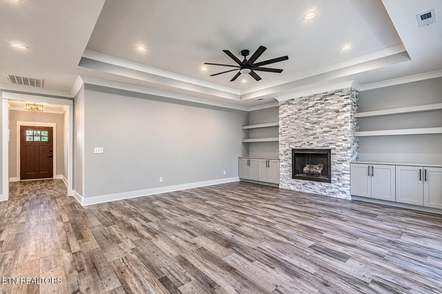 Empty Modern Living Room with Stone Fire - 323 Shadows Lawn Drive, Athens, TN 37303