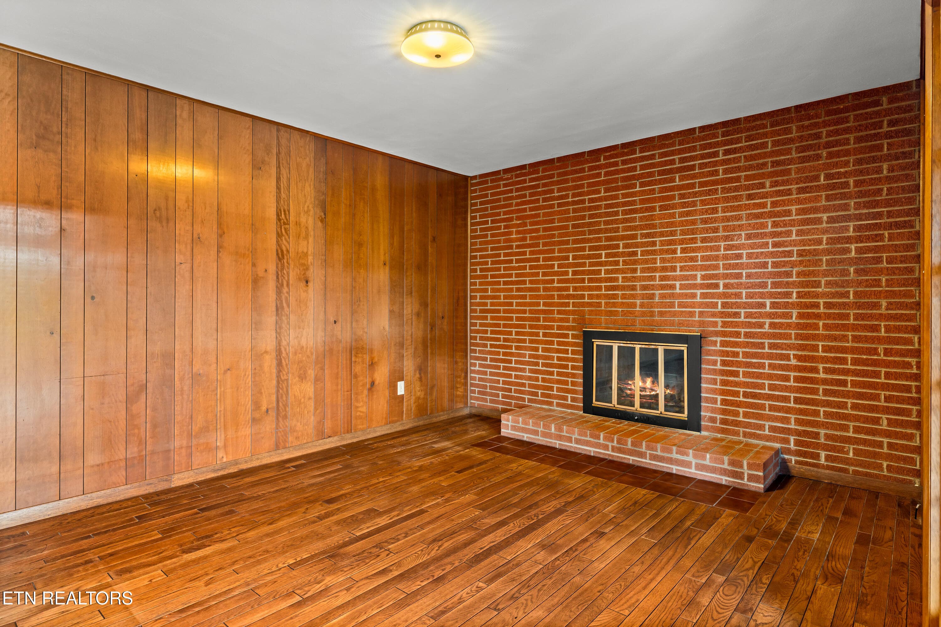 Family room with brick fireplace - 5008 N Wildwood Rd, Maryville, TN 37804