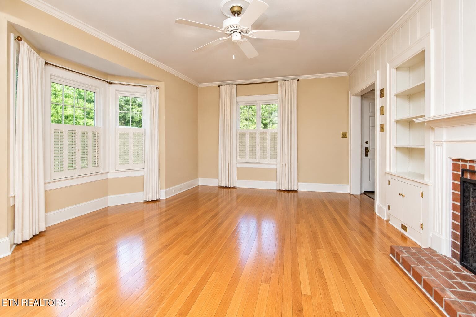 Sunlit Empty Living Room with Fireplace - 6809 Nubbin Ridge Drive, Knoxville, TN 37919