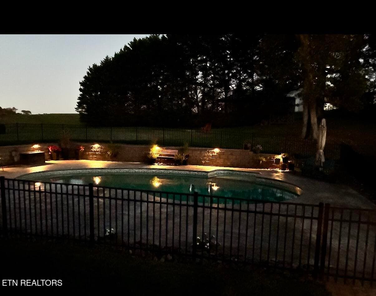 Swimming pool at night - 1420 Foxfire Circle, Seymour, TN 37865