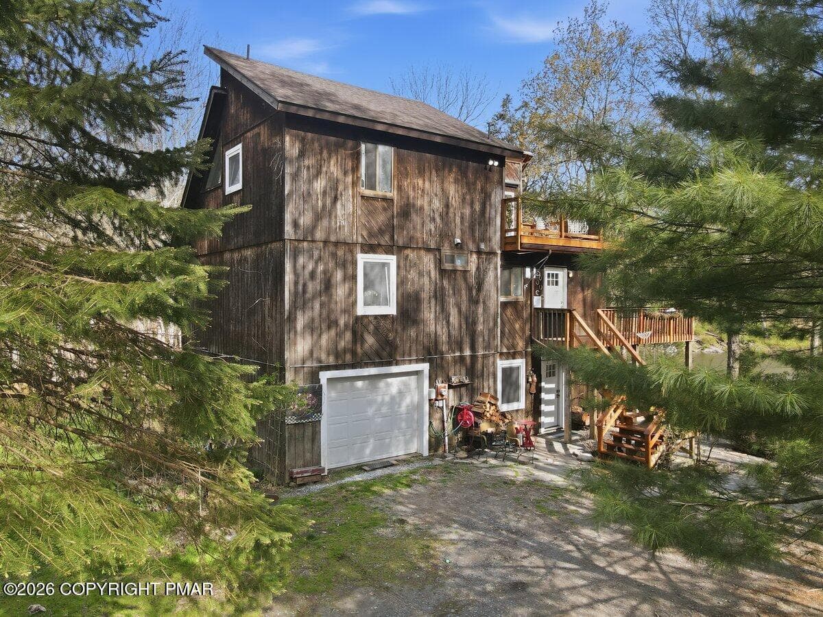 side of the home - 106 Butternut Lane, Canadensis, PA 18325, Canadensis