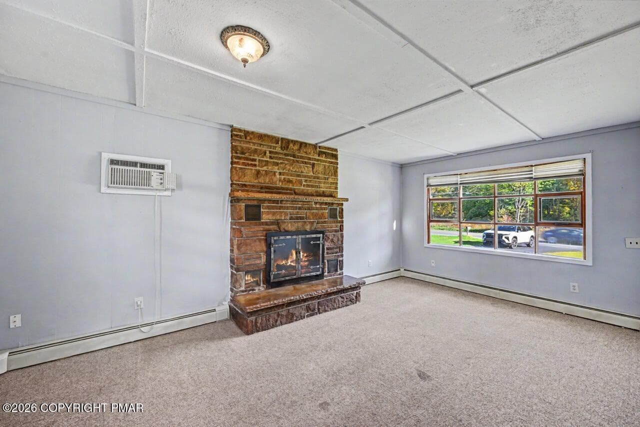 Family Room w/ Stone-Faced Fireplace - 2367 Route 209, Sciota, PA 18354, Sciota