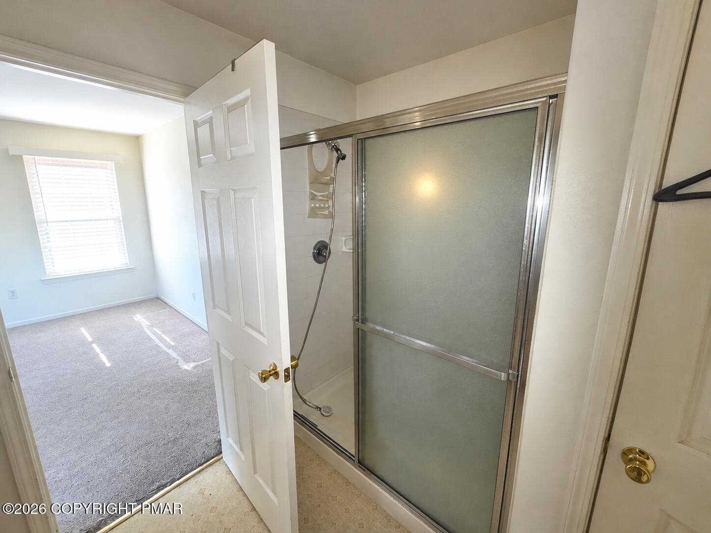 master Bathroom with Open Door and Showe - 179 Kensington Drive, Bushkill, PA 18324