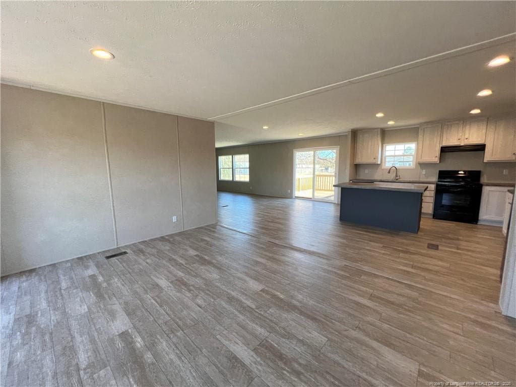 living room view to kitchen - 801 Horseshoe Road, Autryville, NC 28318