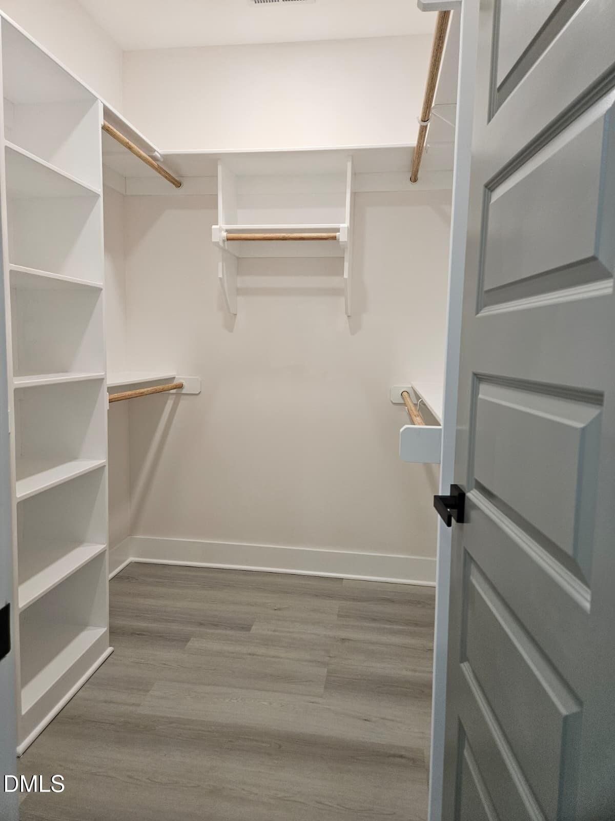 walking closet on master bedroom - 440 Shawnee Drive, Louisburg, NC 27549, Louisburg