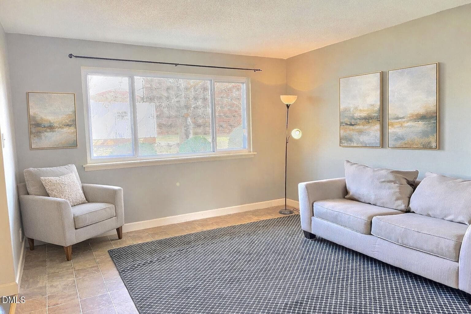 Serene living room with abstract artwork - 2375 Champion Court, Raleigh, NC 27606, Raleigh
