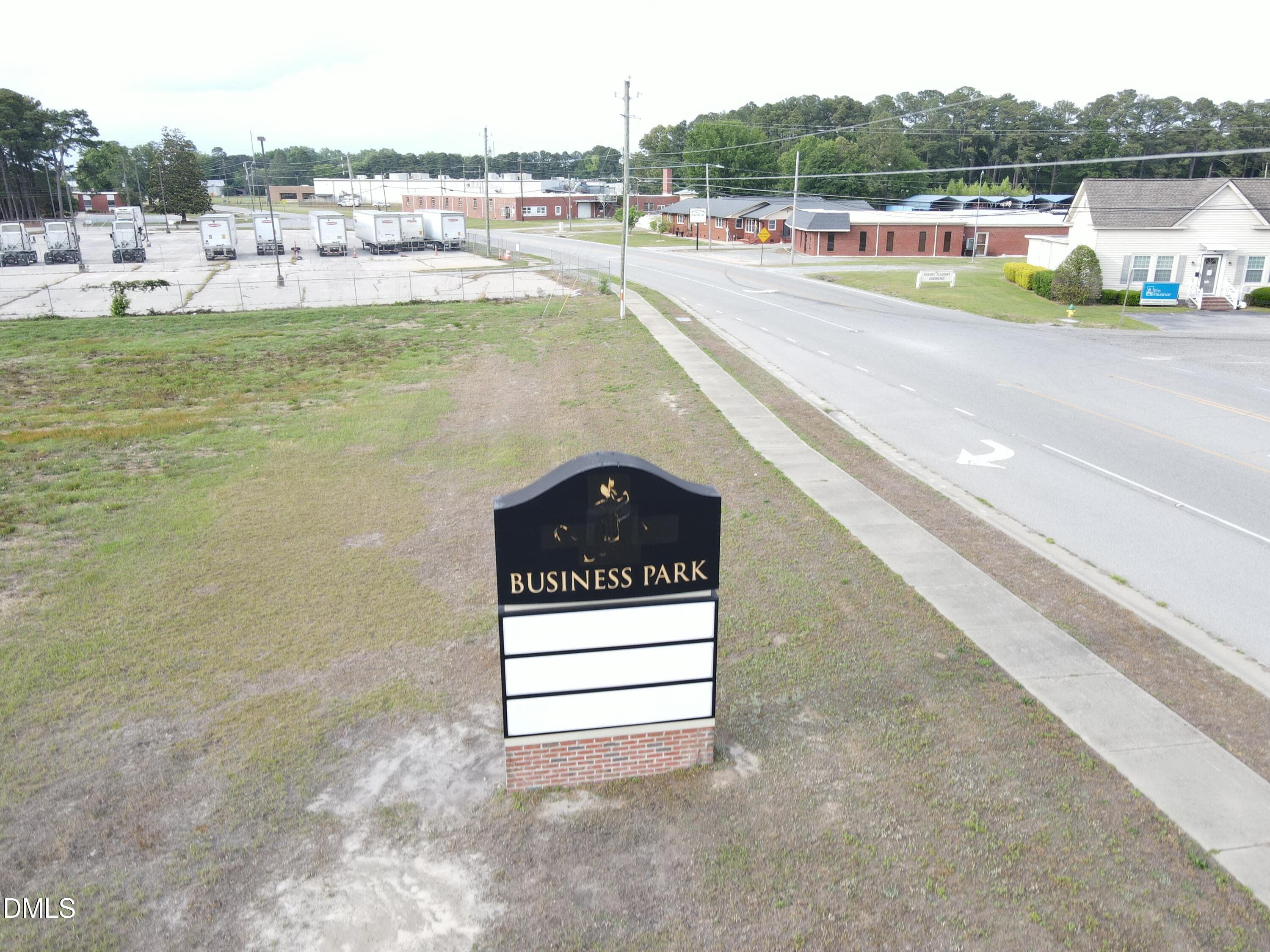 Sign on Lot 4 - 4 Four Oaks Place, Dunn, NC 28334