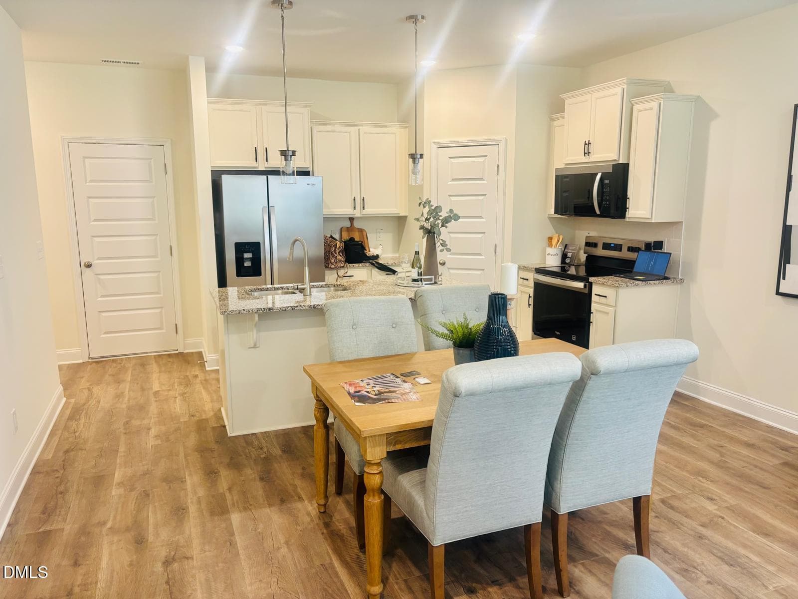 WOTH Model Staged Living Room to Kitchen - 4427 Dominion Crest Drive, Apex, NC 27523