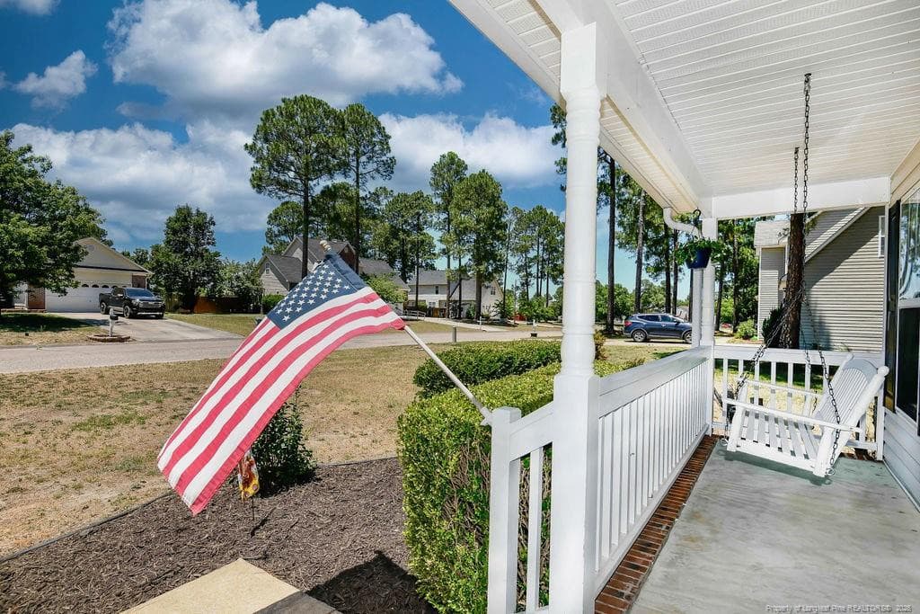 Swing on front porch - 256 Arlington Drive, Cameron, NC 28326