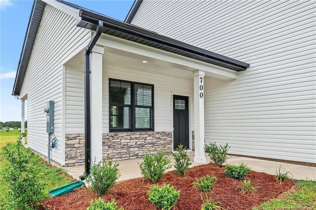 Front porch living in a peaceful setting - 700 Brown Road, Lillington, NC 28328