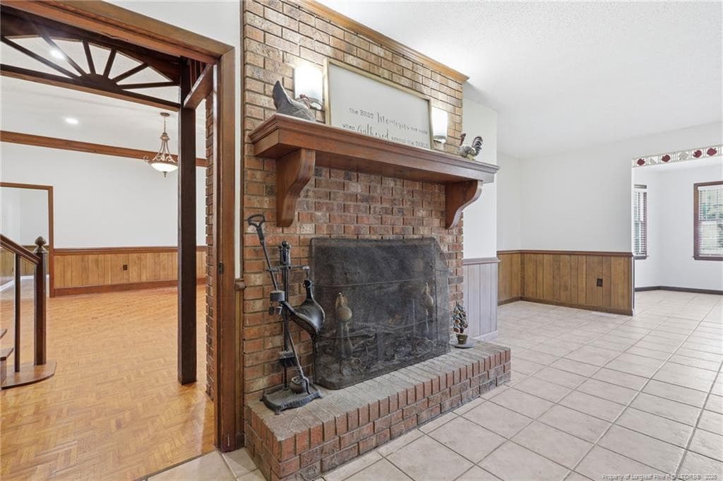 woodturning fireplace in kitchen - 2848 Old Stage Road S, Erwin, NC 28339