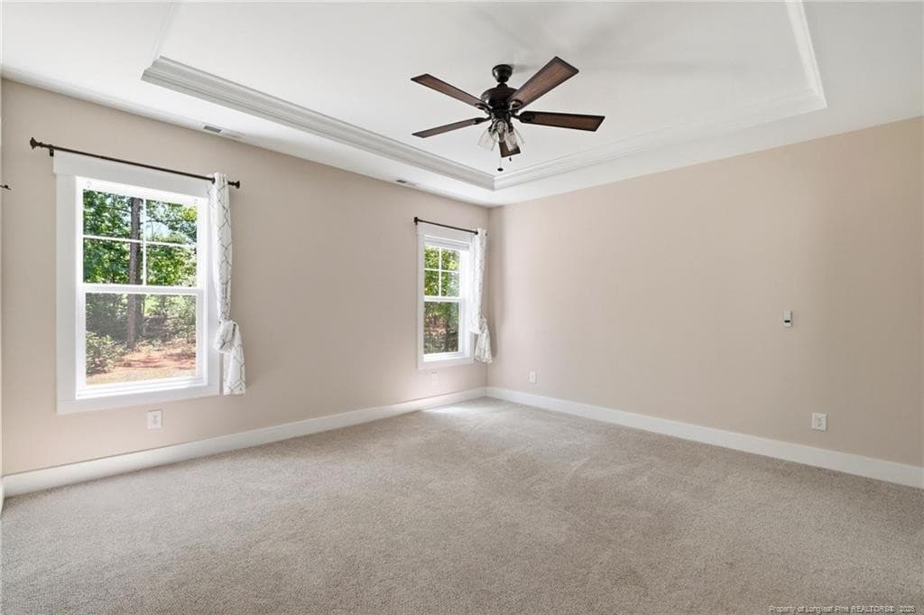 Primary bedroom on the main level - 556 Bald Eagle Drive, Vass, NC 28394