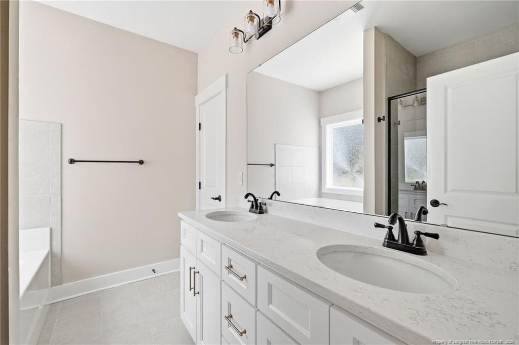 Double sinks with quartz counters - 556 Bald Eagle Drive, Vass, NC 28394