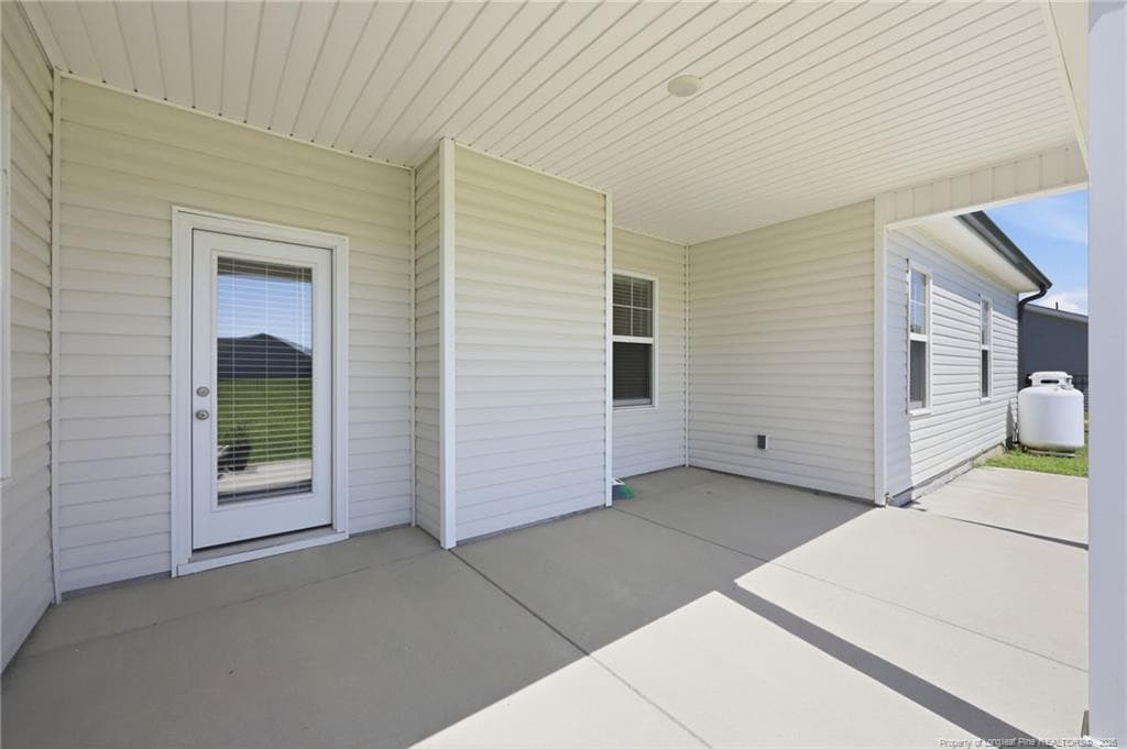 Back covered porch - 18 Mossy Bridge Court, Lillington, NC 27546