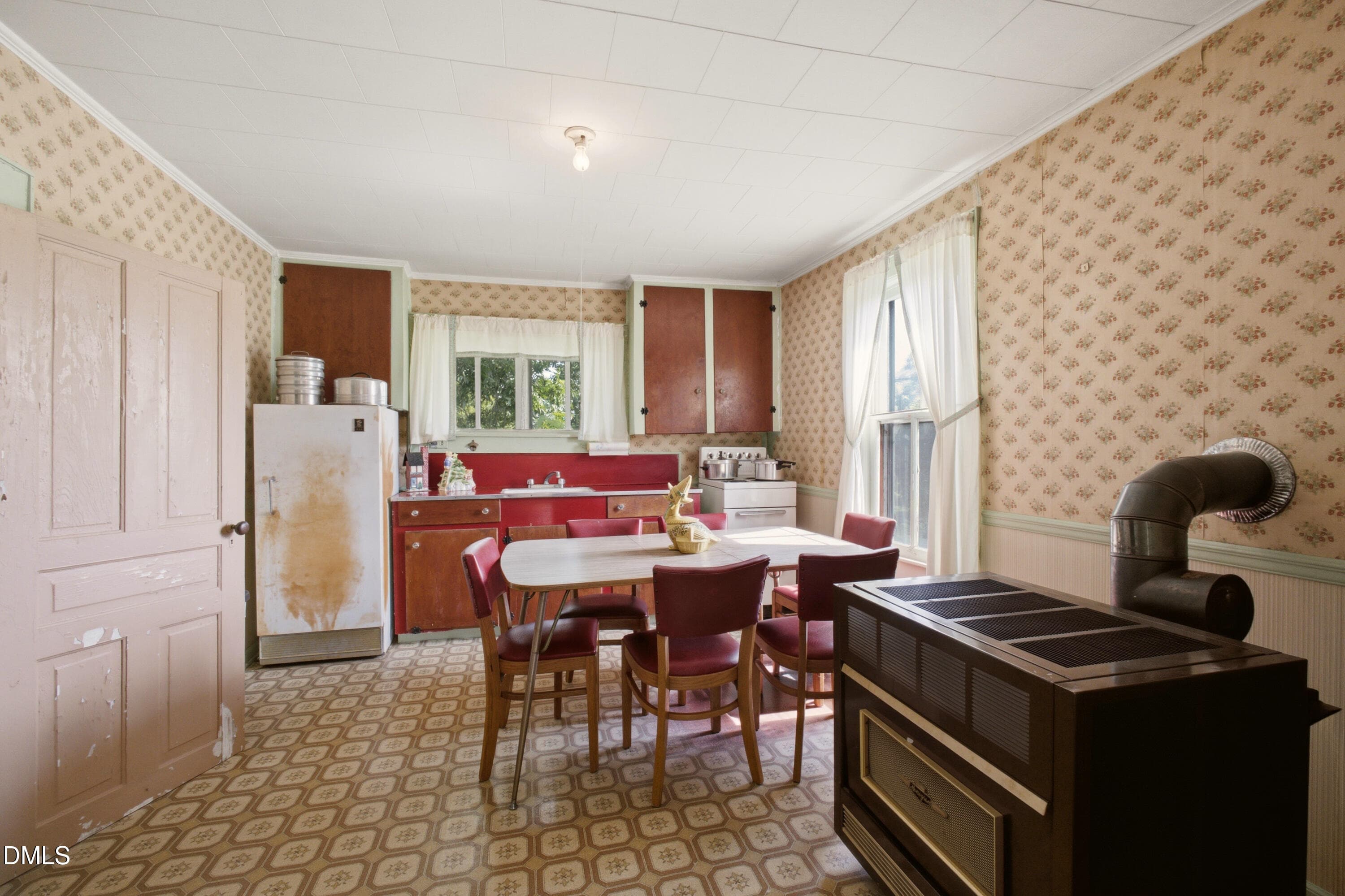 18_Upstairs_Kitchen_w_Oil_Heater - 1884 Silk Hope Liberty Road, Siler City, NC 27344