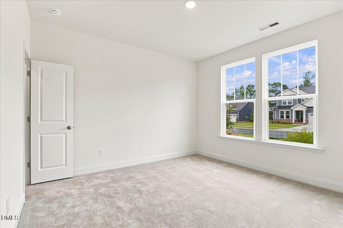 first floor guest bedroom - 1420 Green Cypress Drive, Zebulon, NC 27597