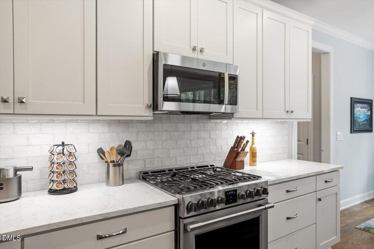 Kitchen with new tiled backsplash and mi - 4235 Henderson Place, Pittsboro, NC 27312