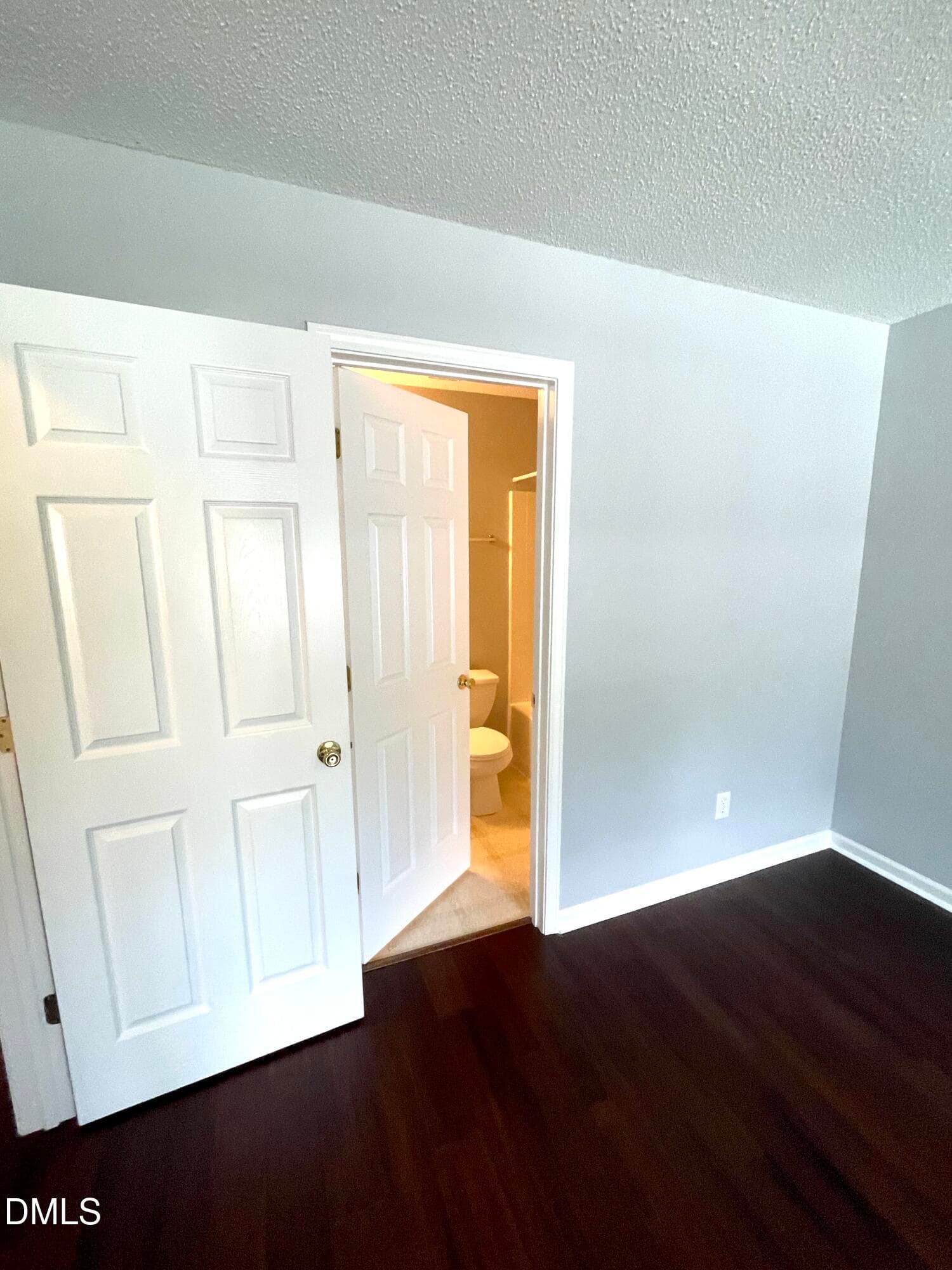 Bedroom 2 entry to full bath - 5428 Roan Mountain Place, Raleigh, NC 27613, Raleigh