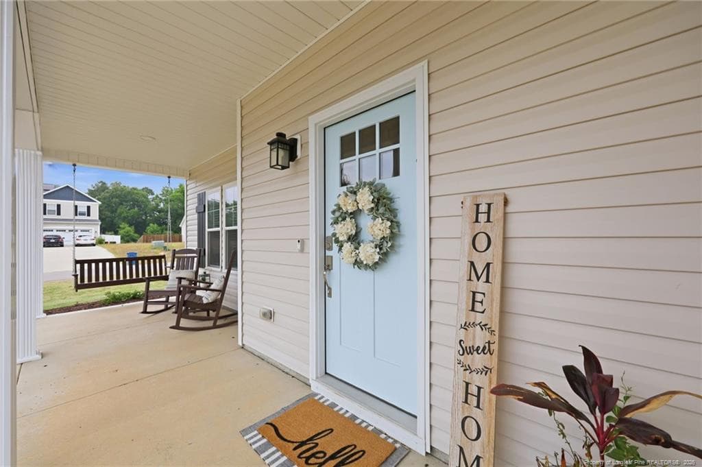 Wrap around porch with swing - 101 Woodford Lane, Vass, NC 28394