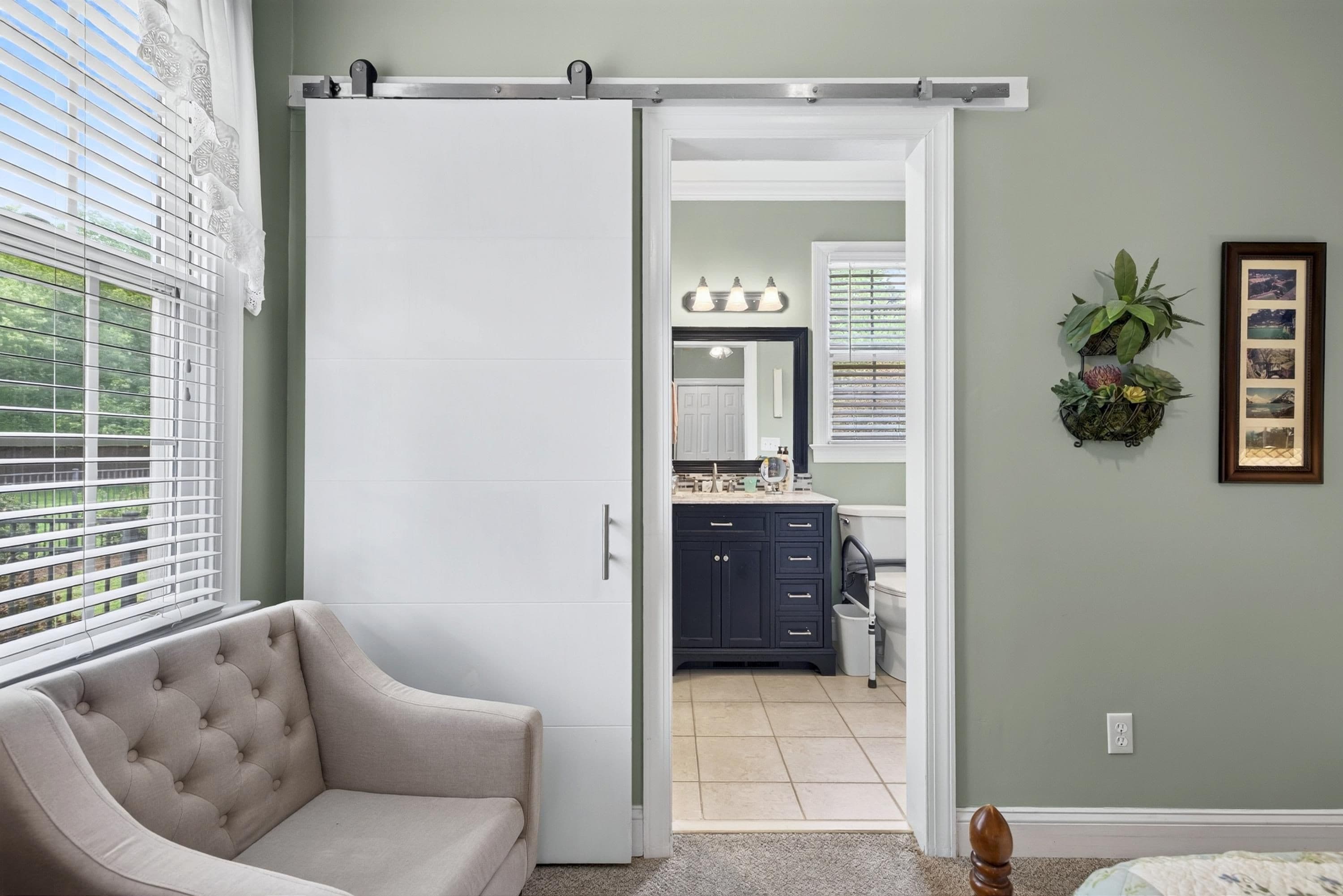 Barn door to bath of apartment area - 3024 Whitehart Lane, Raleigh, NC 27606, Raleigh