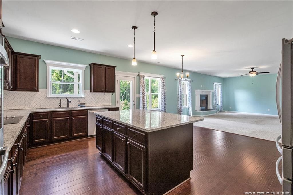 Kitchen open to living room - 6132 Shannon Woods Way, Hope Mills, NC 28348