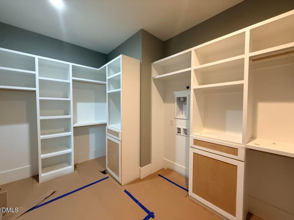 23 - Primary Closet with 1st Floor Laund - 5904 Leone Pride Circle, Raleigh, NC 27603, Raleigh