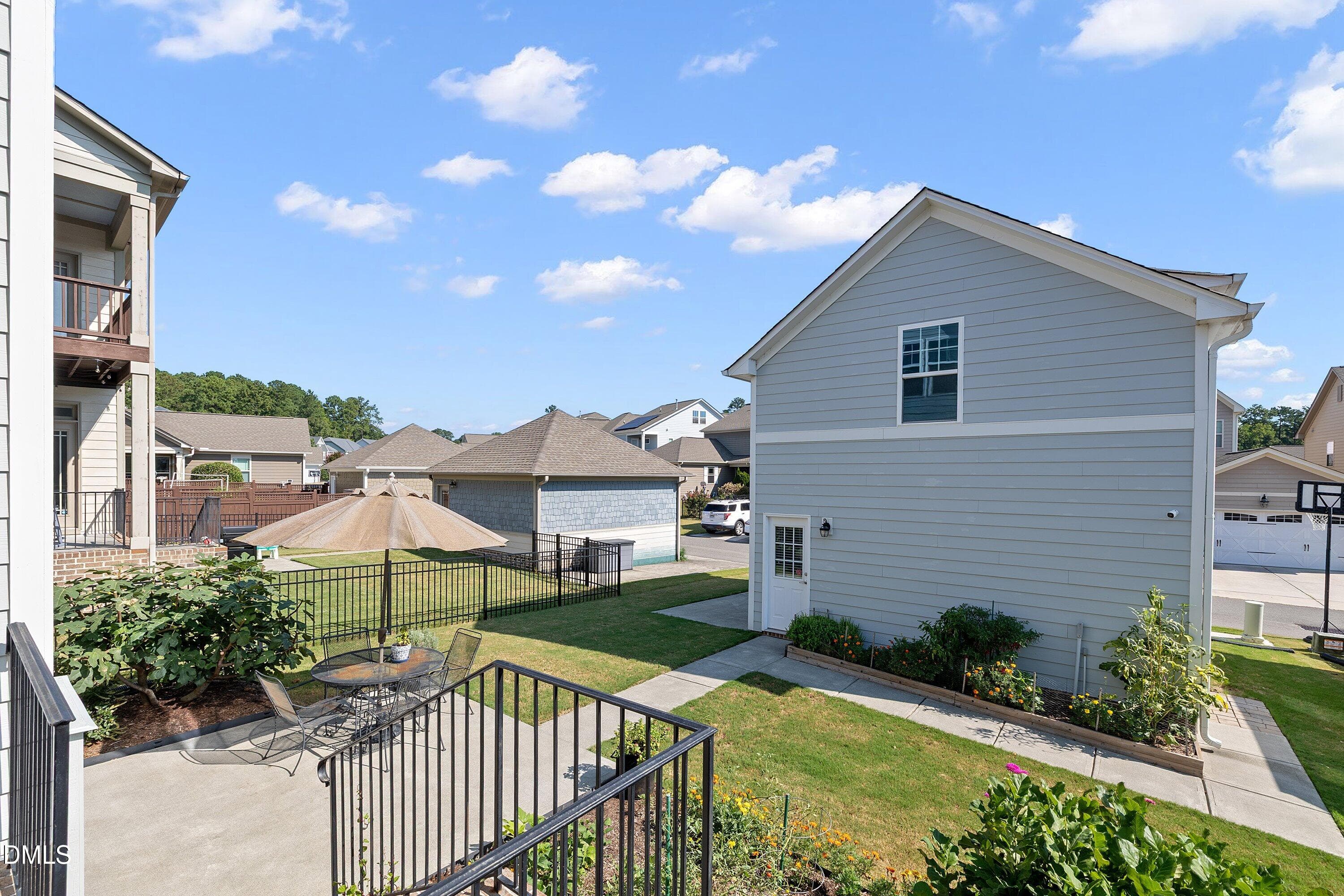 Back deck leads to backyard and garage - 1005 Woodland Grove Way, Wake Forest, NC 27587, Wake Forest