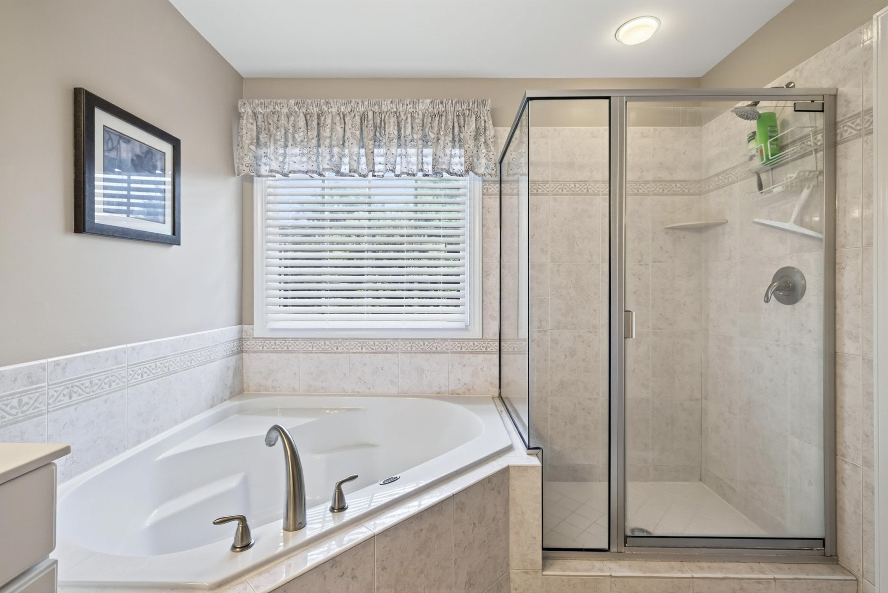 Primary Bathroom Shower and Corner Tub - 3024 Whitehart Lane, Raleigh, NC 27606, Raleigh
