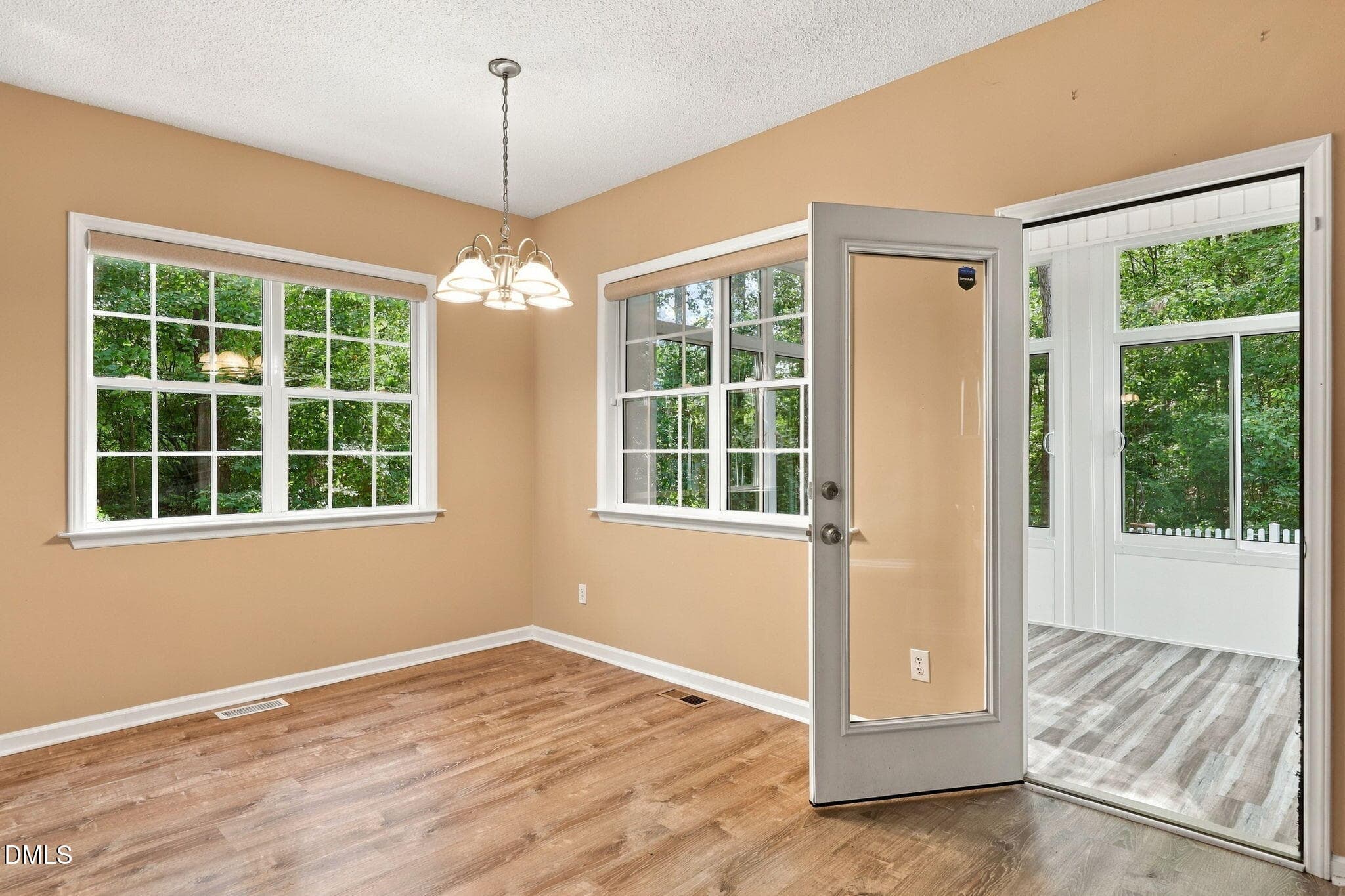 BREAKFAST AREA OPENS TO 3 SEASON ROOM - 152 Skipping Rock Lane, Garner, NC 27529