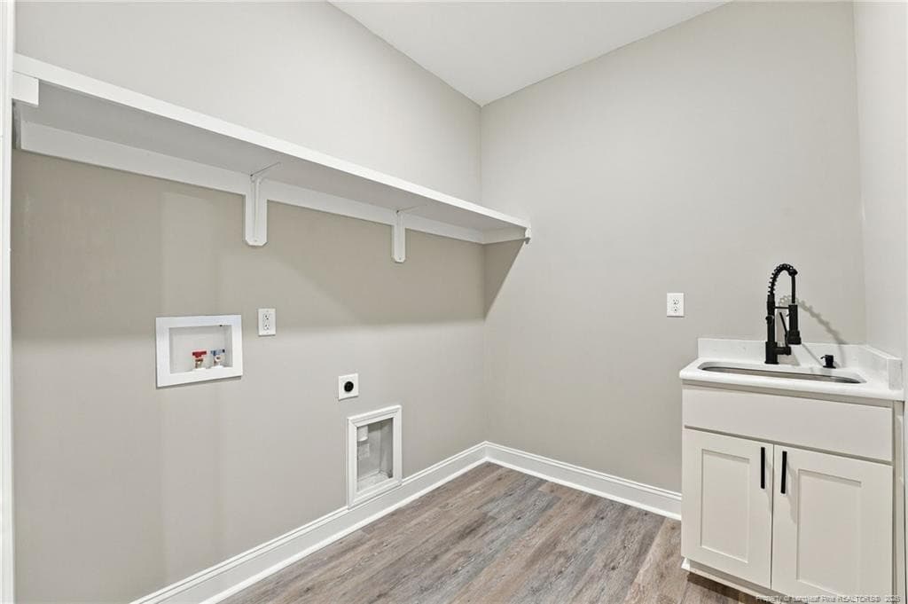 laundry with utility sink - 26820 Peach Orchard Road, Wagram, NC 28396