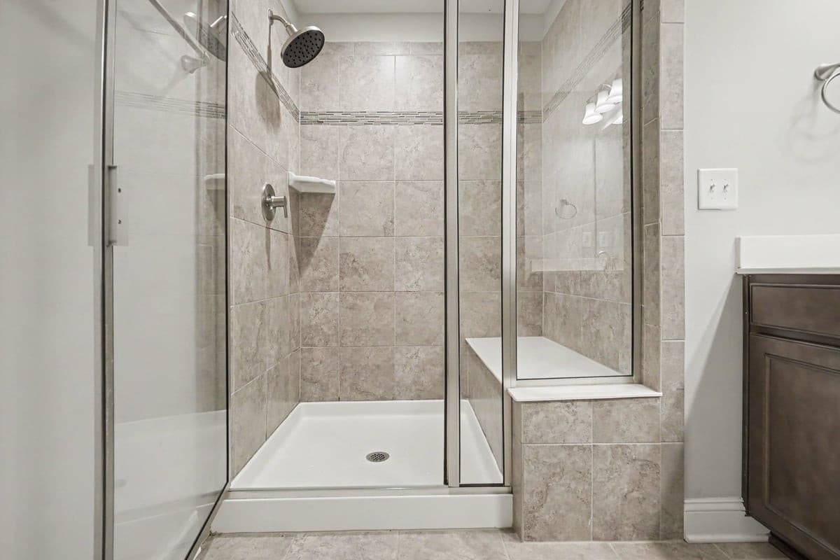 Tiled shower with bench seat - 1115 Lotus Lilly Drive, Durham, NC 27713