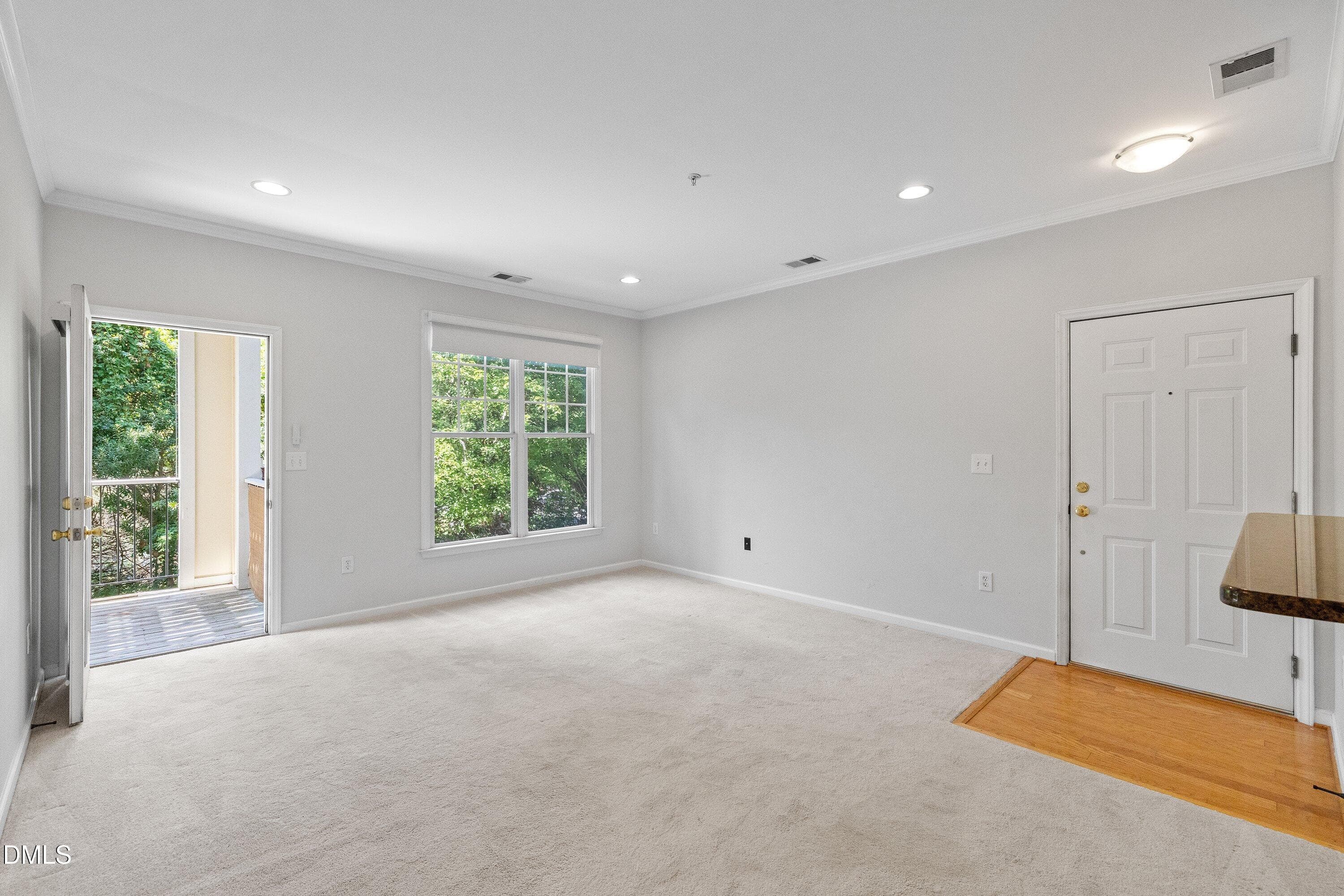 Living Room Open to Balcony - 800 Moratuck Drive 206, Raleigh, NC 27604