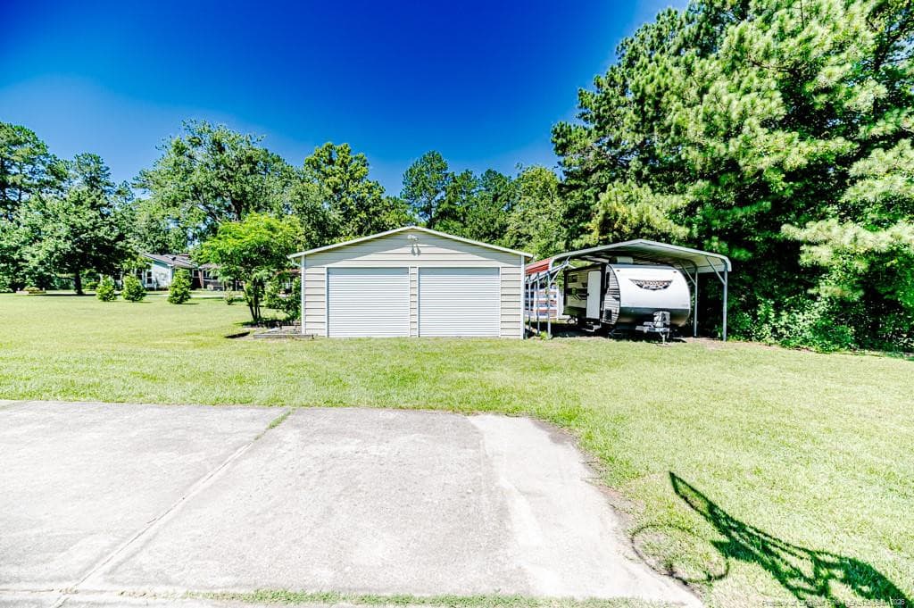 Garage view toward Workshop / Carport - 10110 NC 27 Highway W, Lillington, NC 27546
