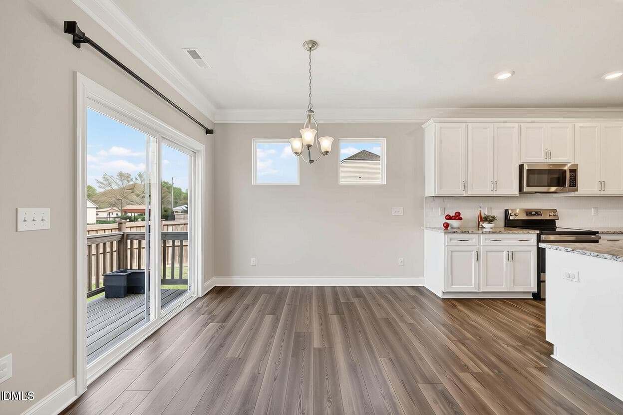 Dining Room without table and curtains - 4324 Beckel Road, Willow Springs, NC 27592