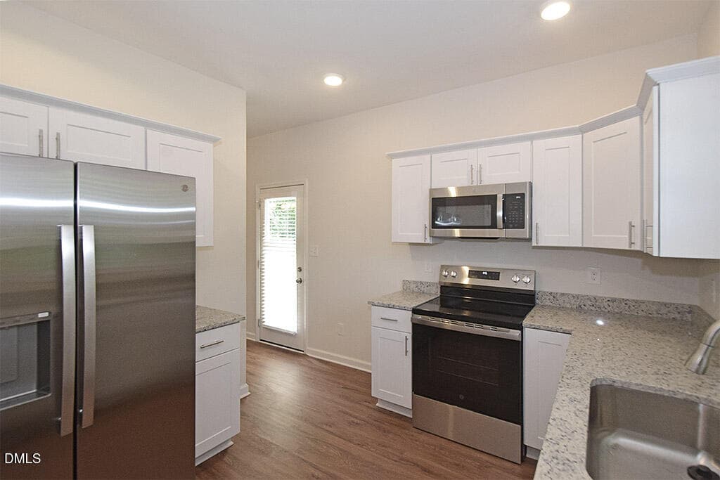 Kitchen from Garage entry - 3439 Littlefield Way, Greensboro, NC 27405