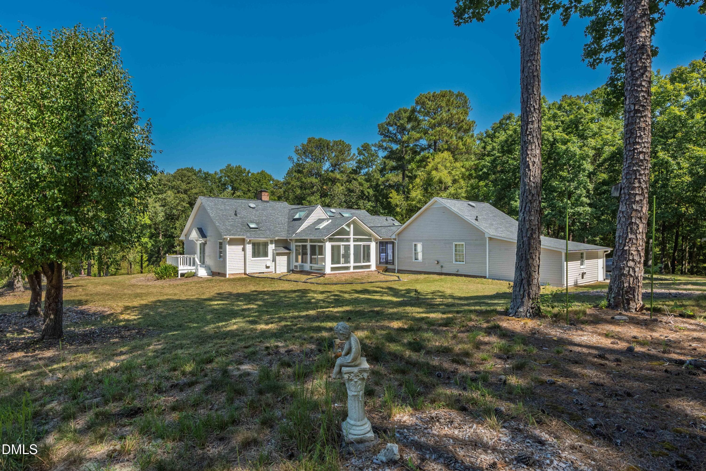 back of home exterior - 4508 Rogers Road, Durham, NC 27703, Durham