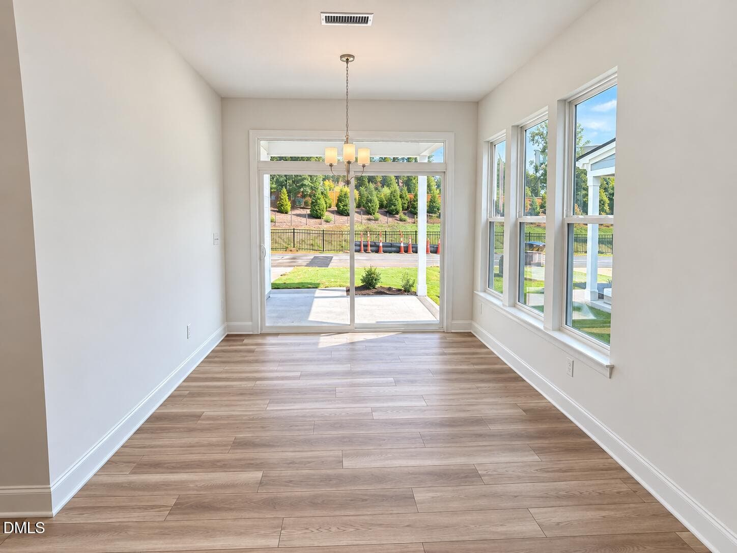 Dining Area with Sliders to Porch - 532 Traditions Grande Boulevard, Wake Forest, NC 27587