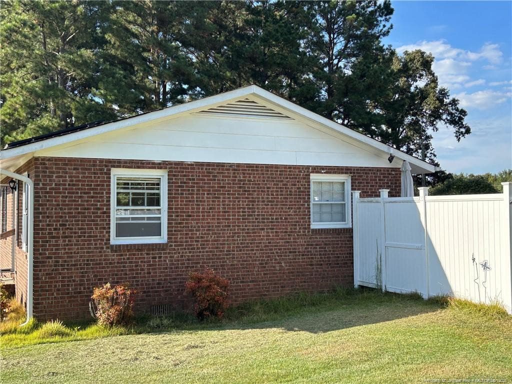Side View with Fence - 754 W Horne Road, Rowland, NC 28383