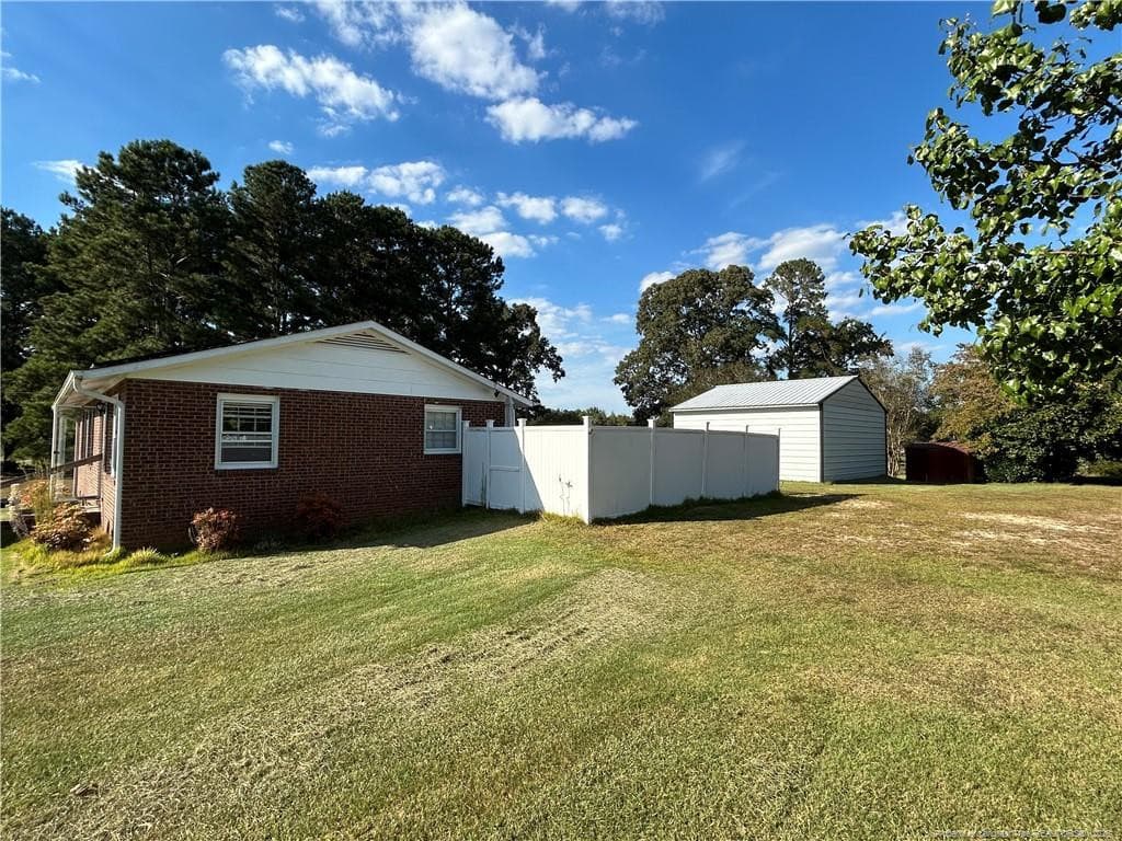 Side View with Fence - 754 W Horne Road, Rowland, NC 28383