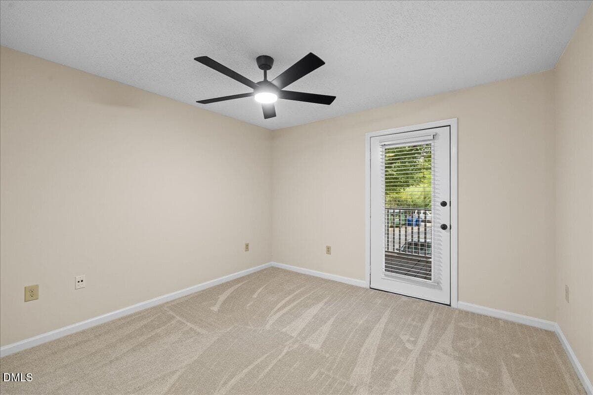 Primary Bedroom Door to Balcony - 1301 Hillbrow Lane 203, Raleigh, NC 27615