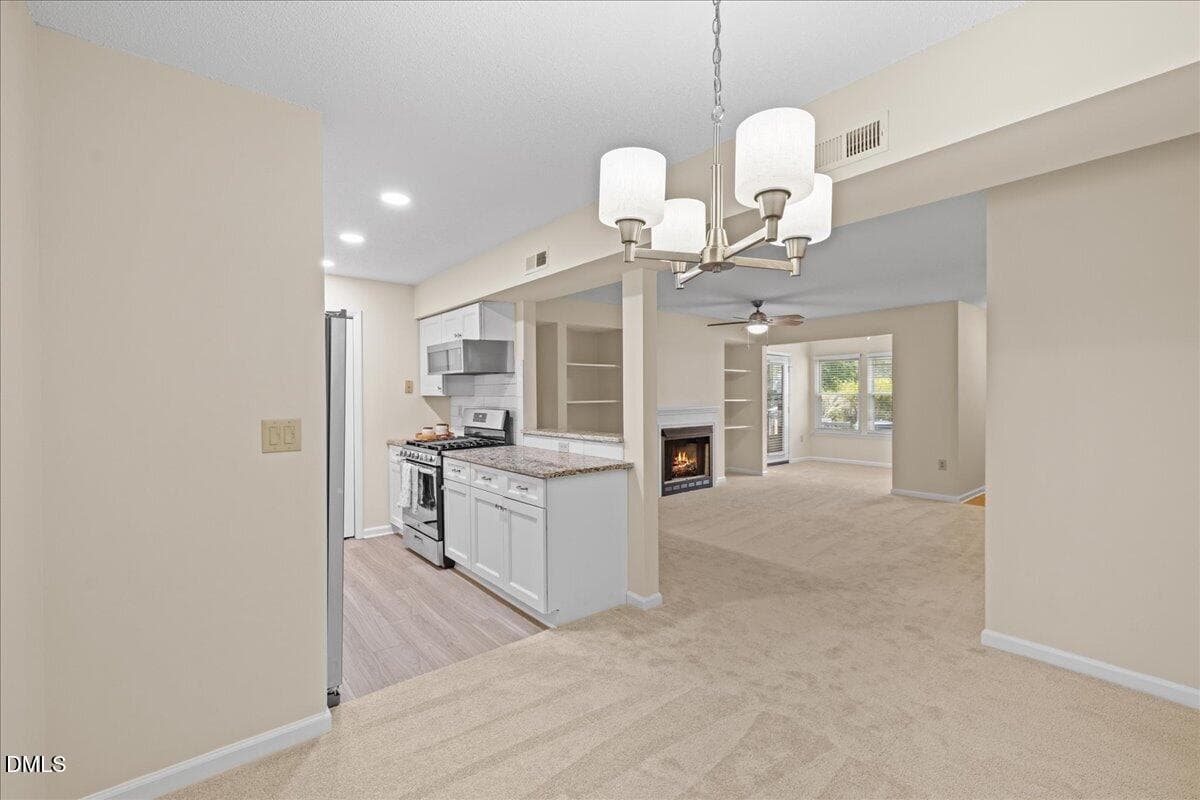 Dining Area leading into Living Room - 1301 Hillbrow Lane 203, Raleigh, NC 27615