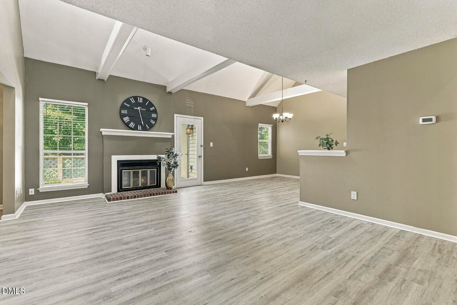 Living room open to kitchen and dining - 407 Gooseneck Drive B5, Cary, NC 27513