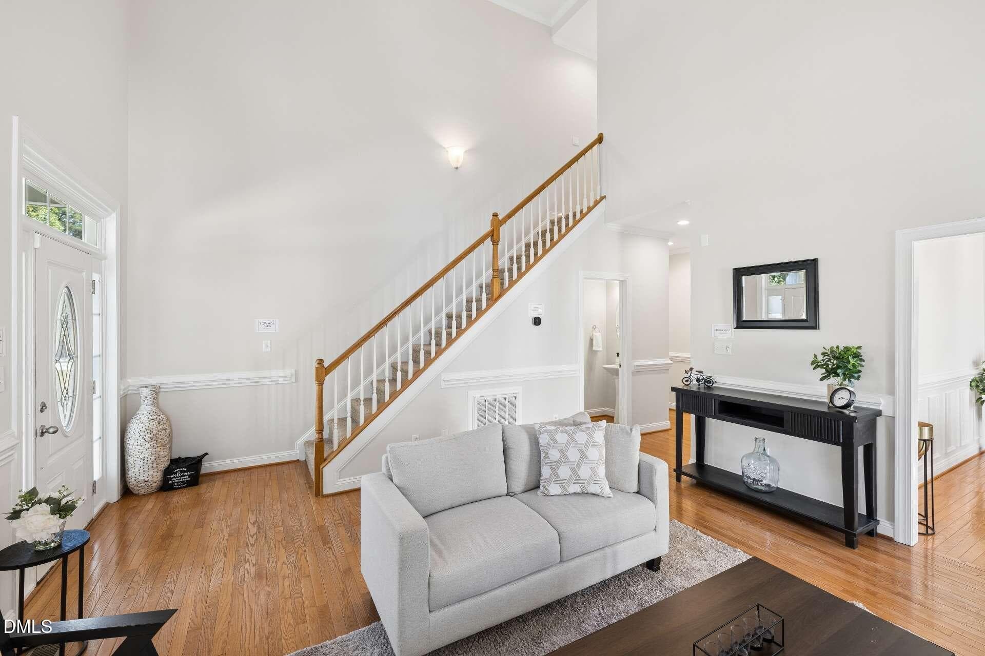 Living Room Alt View with Staircase - 516 Deacon Ridge Street, Wake Forest, NC 27587