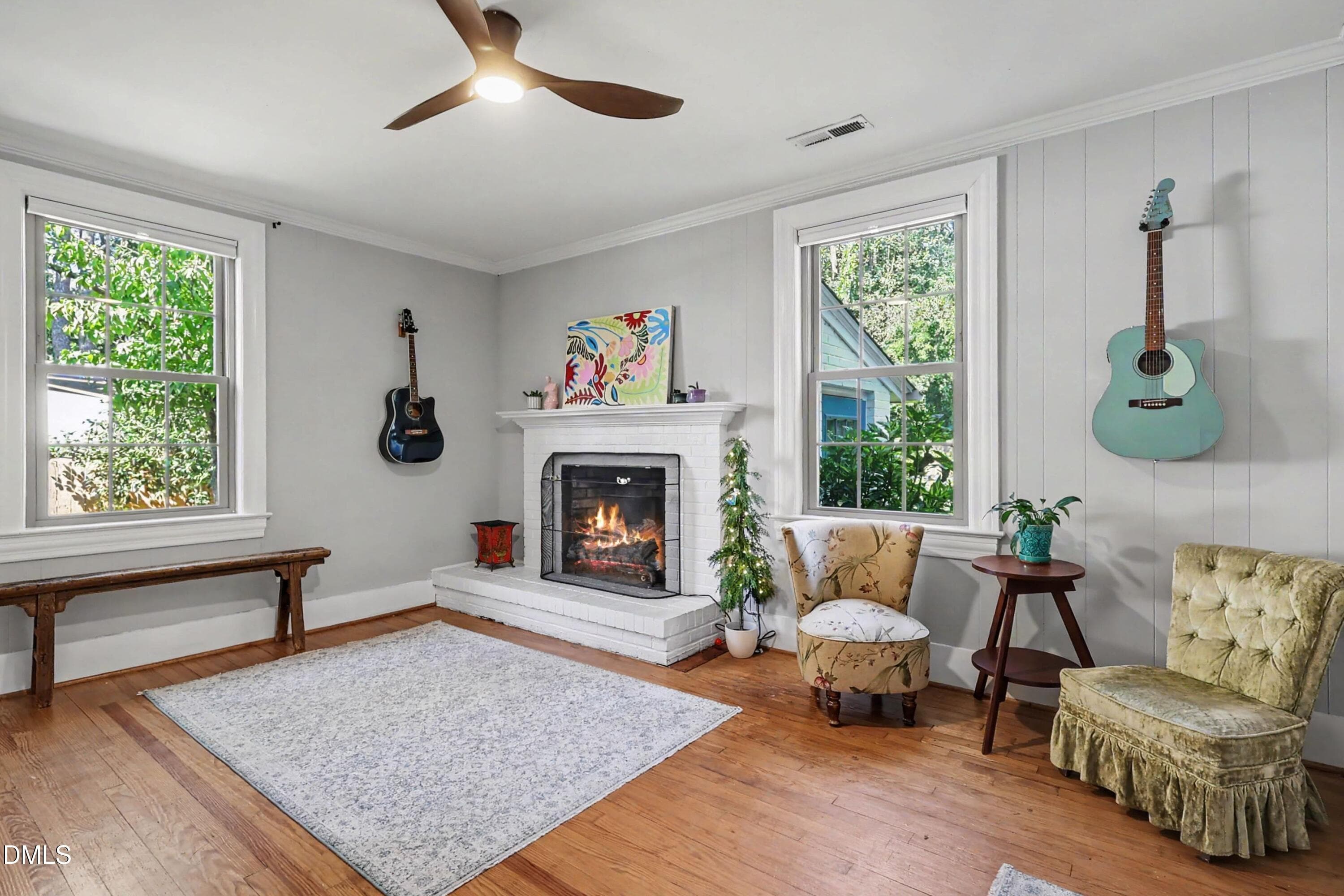 Den /fireplace. Built in cabinet staying - 305 S Walnut Street, Spring Hope, NC 27882, Spring Hope