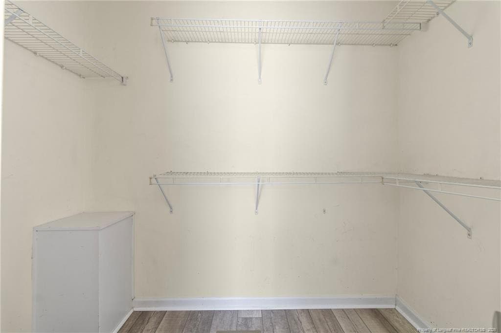 Walk-in closet primary bedroom - 117 Blue Water Drive, Raeford, NC 28376