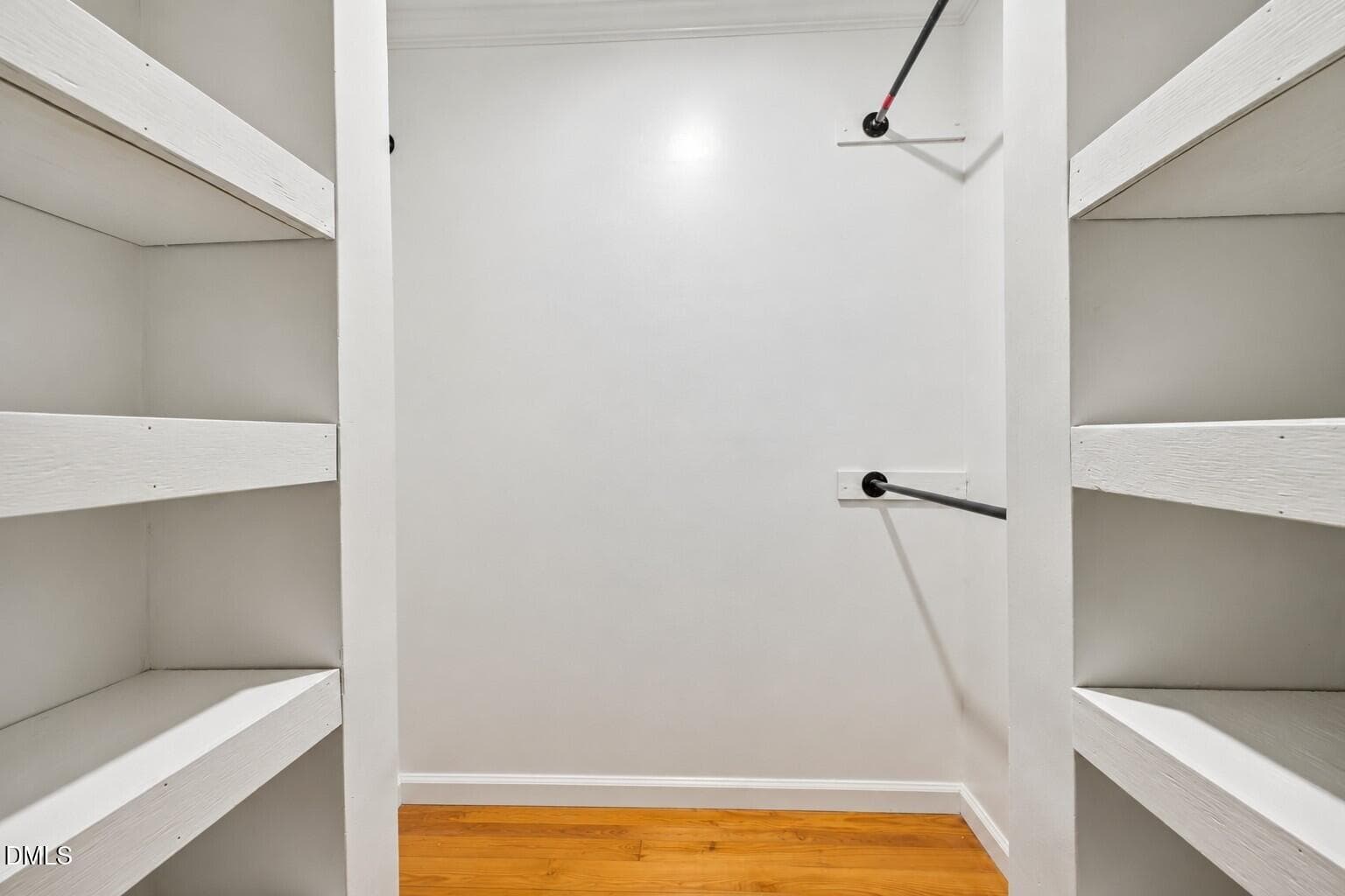 Minimalist White Walk-In Closet - 4093 Purnell Road, Wake Forest, NC 27587, Wake Forest