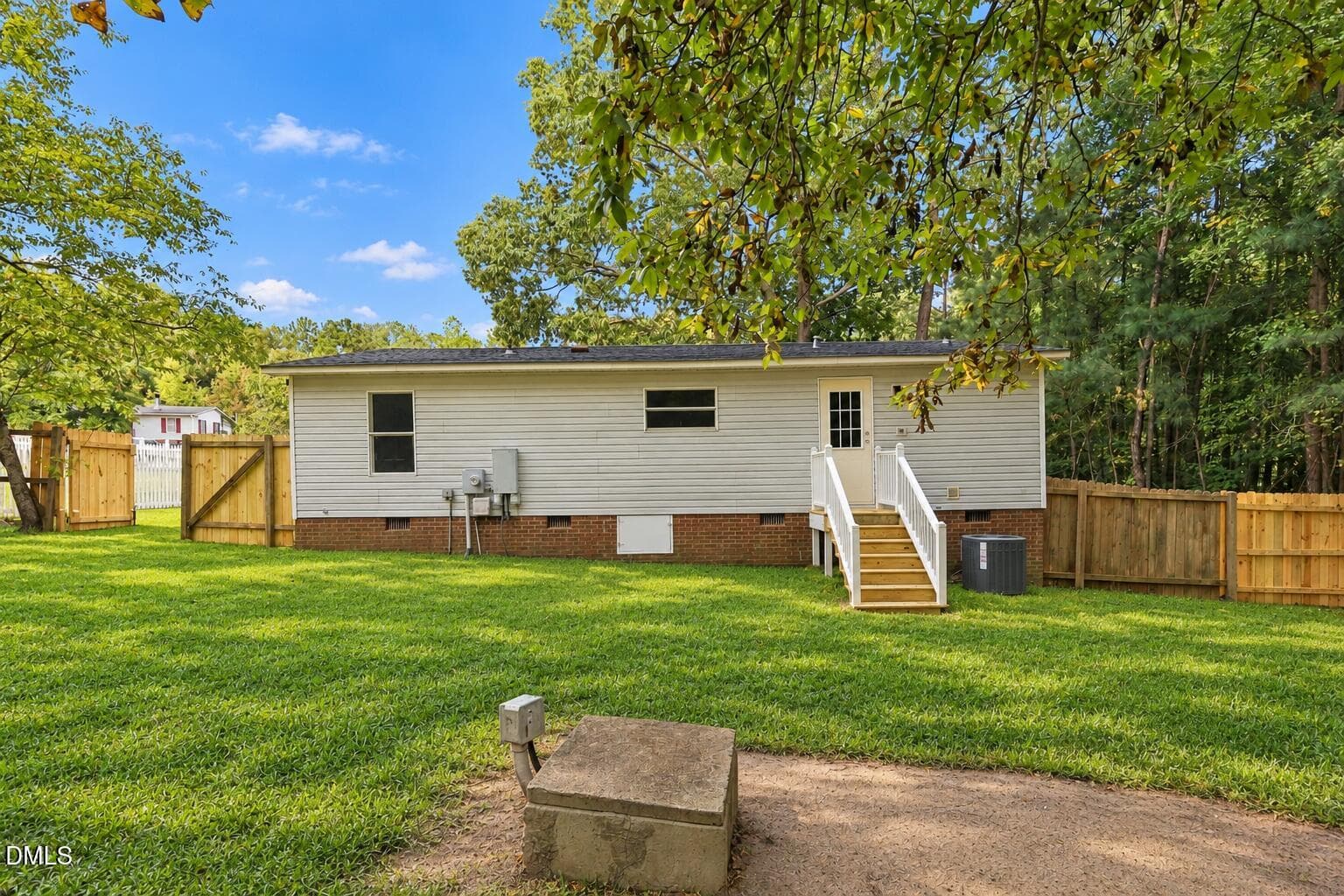 Freshened home exterior with natural law - 484 Valley Forge Way S, Cameron, NC 28326