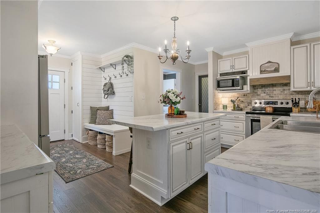 KITCHEN FROM FORMAL DINING ROOM - 220 E David Parnell Street, Parkton, NC 28371