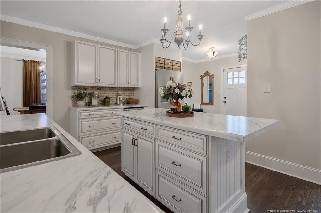 KITCHEN VIEW TO DINING/OFFICE ROOM - 220 E David Parnell Street, Parkton, NC 28371